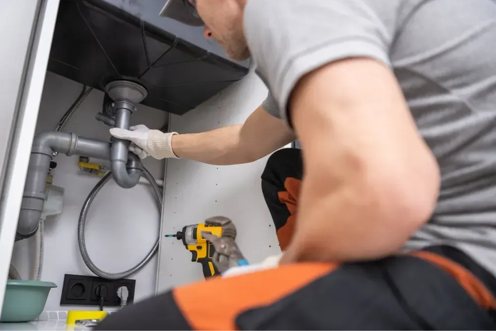 plumber-under-sink